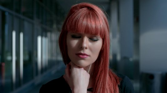 velvet-haired woman closing her eyes