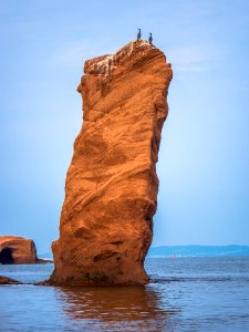 rock formation on body of water photo