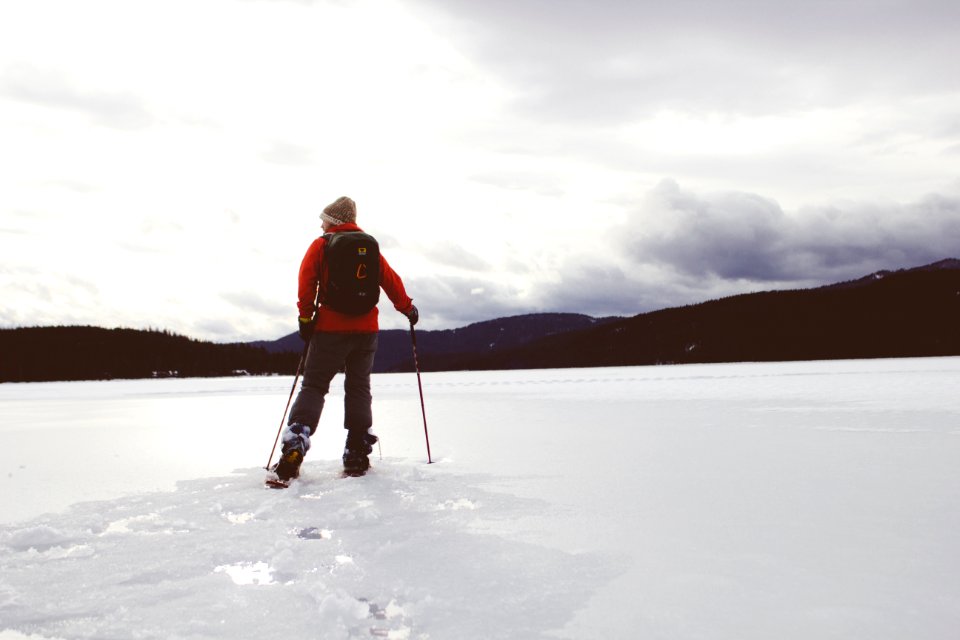 man standing on snow covered surface