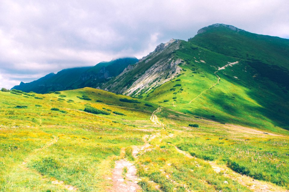 green mountain under cloudy sky