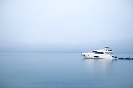 white yacht on body of water photo