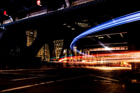 black and gray concrete building at nighttime timelapse photography photo