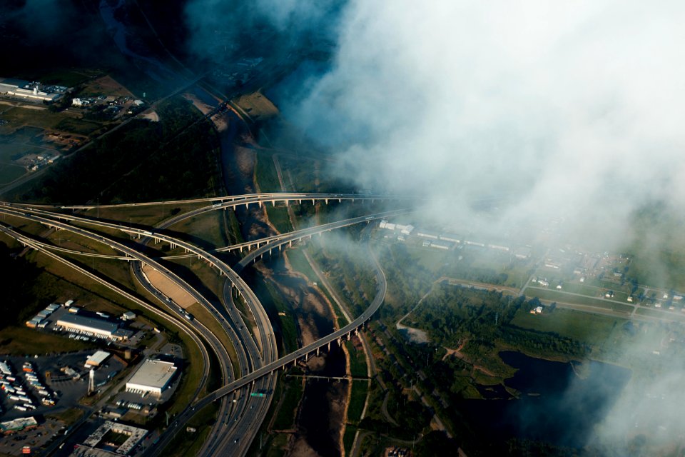 aerial photography of gray concrete road near trees during daytime