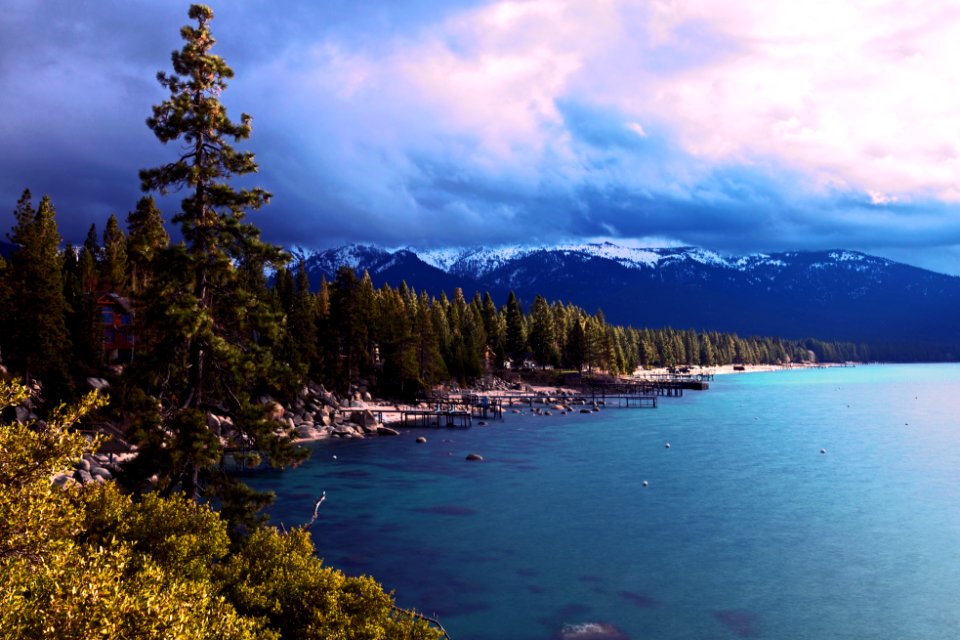 body of water near mountain photo