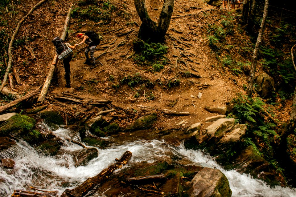 two person hiking in the mountain terrain