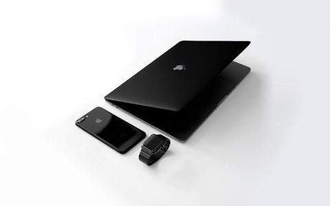 black Macbook near black iPhone 7 Plus and black Apple Watch photo