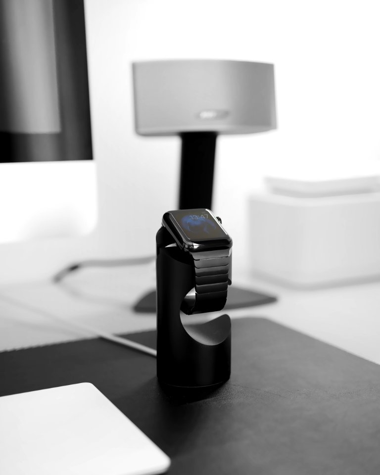space black case Apple Watch on magnetic charger