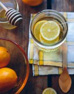 clear glass container with lemon slices photo