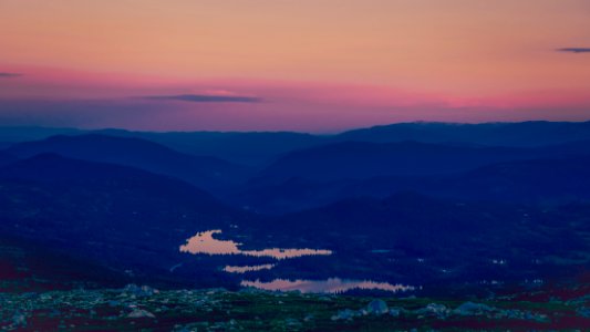 body of water surrounded by land photo