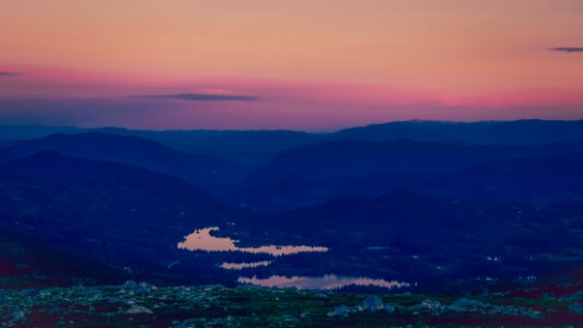 body of water surrounded by land photo photo