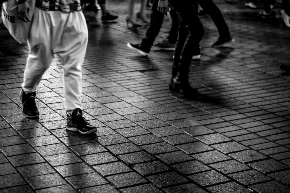 men walking on concrete tiled ground