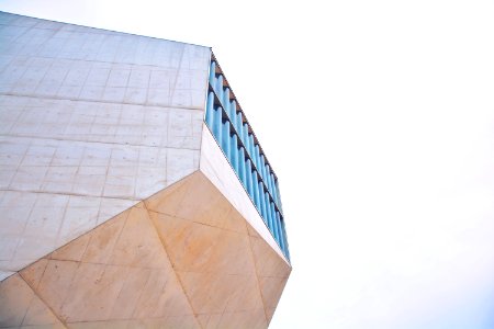 brown and blue building under cleay sky at daytime