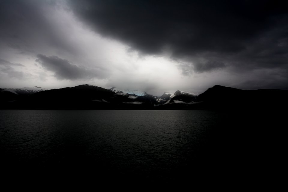 body of water during cloudy daytime