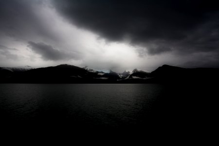 body of water during cloudy daytime