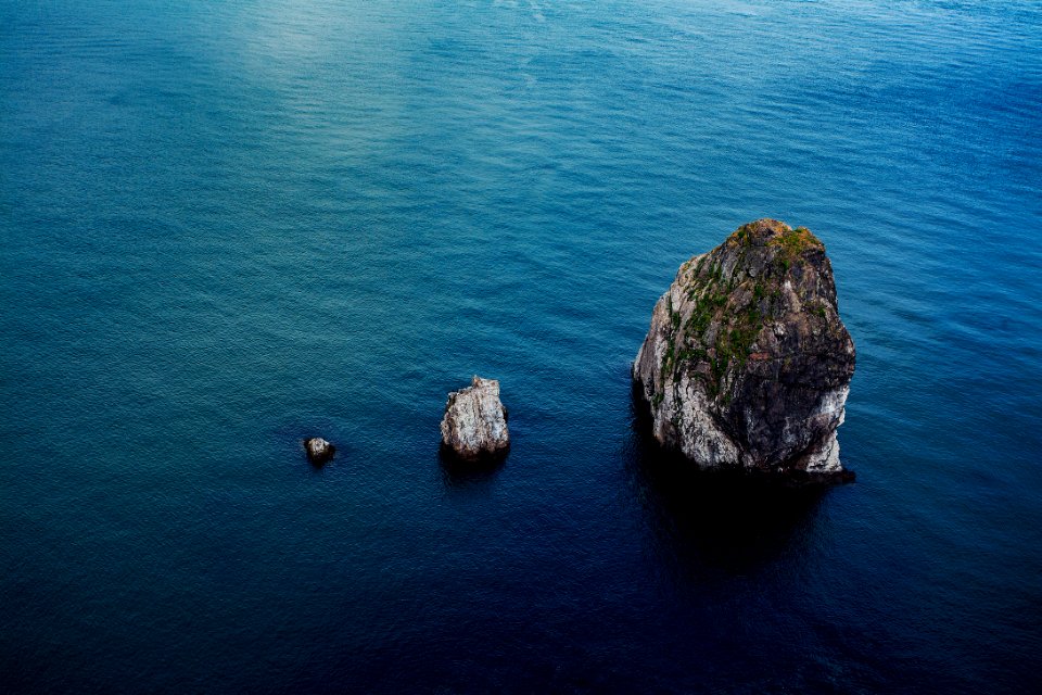 rock formation on body of water