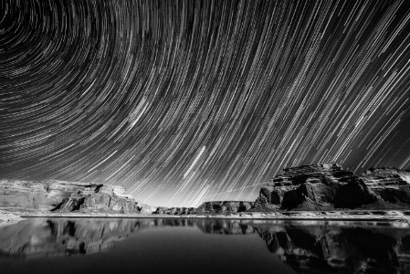 grayscale photography of calm body of water under sky photo