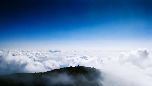 aerial photo of mountain reaching clouds photo