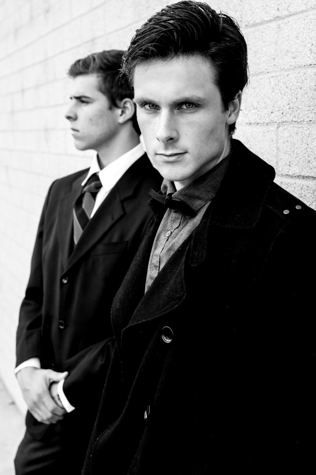 man in black trench coat
