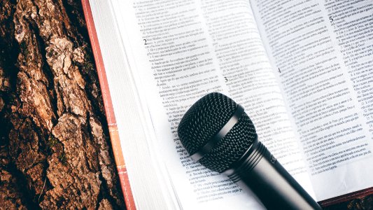 black microphone on book page photo