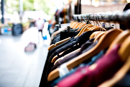 selective focus photography of hanged clothes