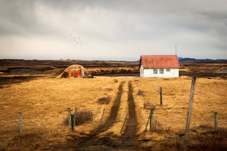 white concrete house during cloudy day photo photo