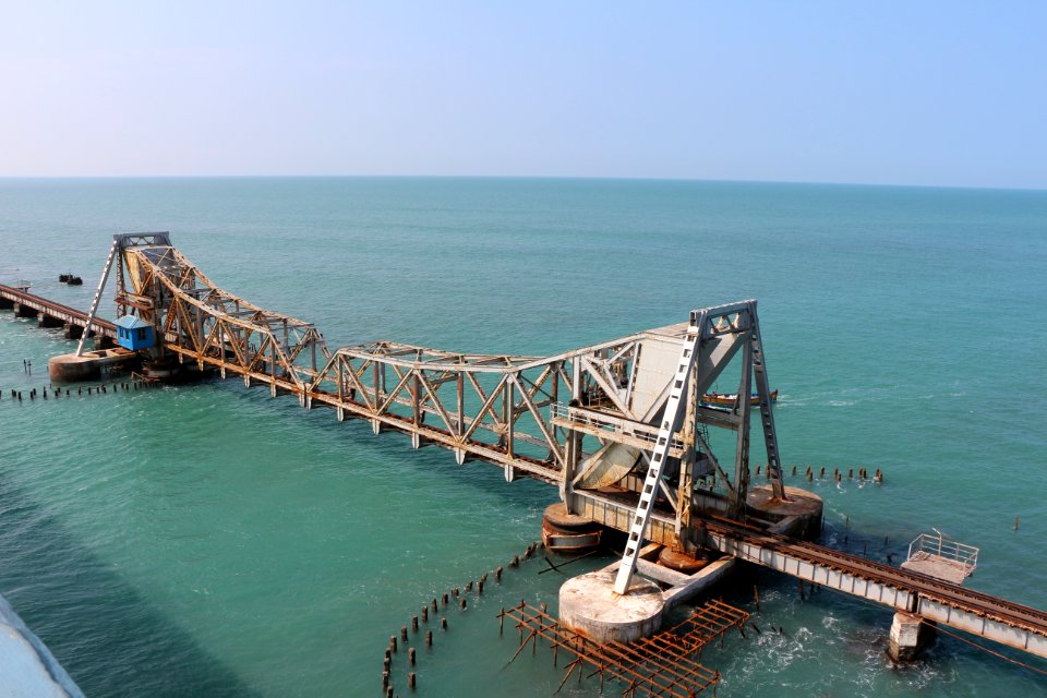 brown wooden dock on blue sea under blue sky during daytime photo