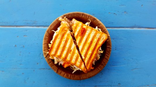 two slices of sandwich on brown container