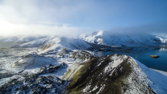 aerial view photography of snow mountain near lake