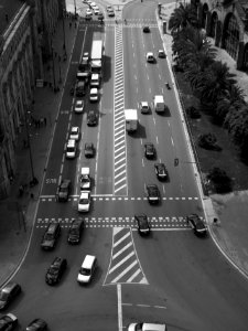 birds eye view of vehicles on road between buildings photo