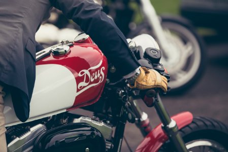 person riding red and gray motorcycle photo