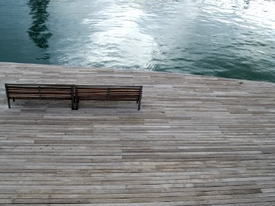 aerial photography of bench near body of water photo