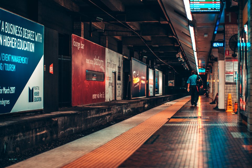 man walking in subway photo