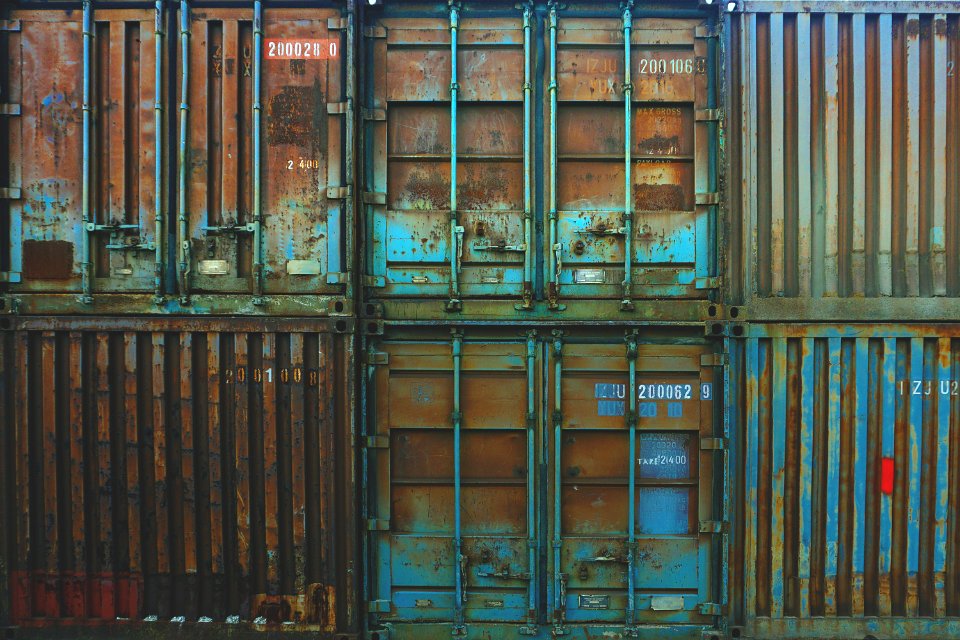 six blue freight containers