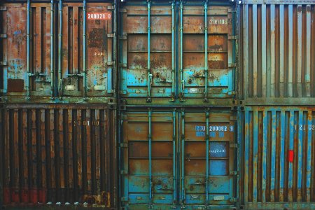 six blue freight containers