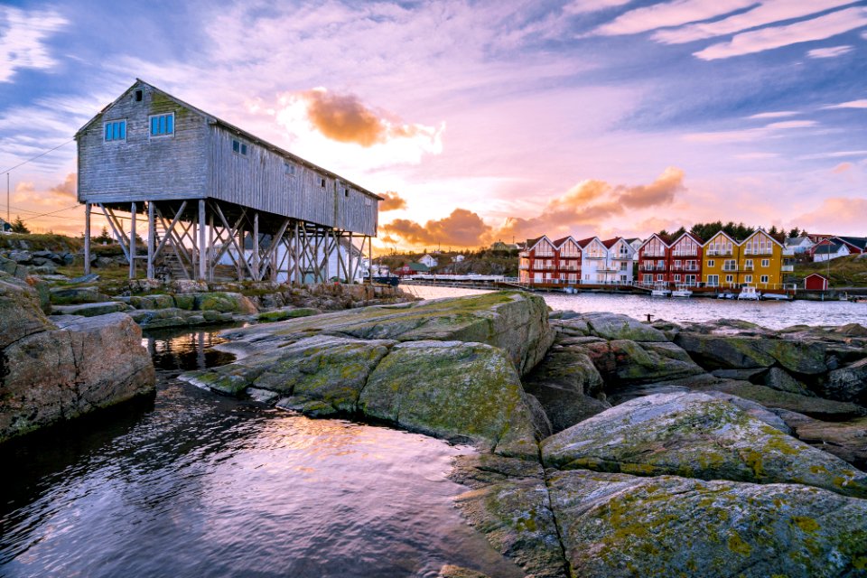 assorted houses near body of water during daytime photo