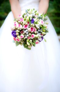 woman holding white and pink flower bouquet photo