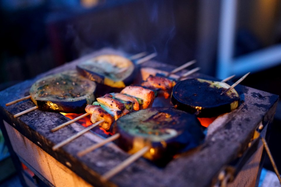three assorted barbeques on black grill