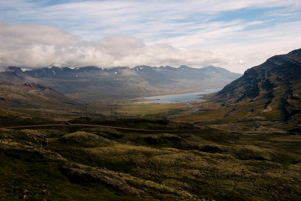 gray mountain near body of water at daytime photo