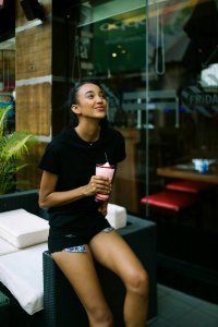 woman holding shake cup photo