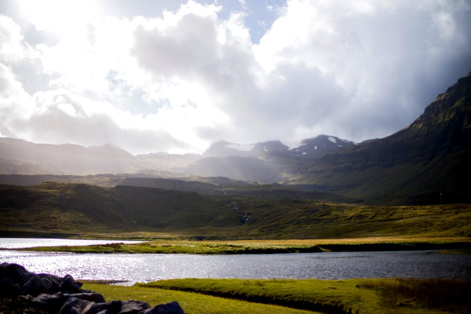 landscape photography of body of water near mountain