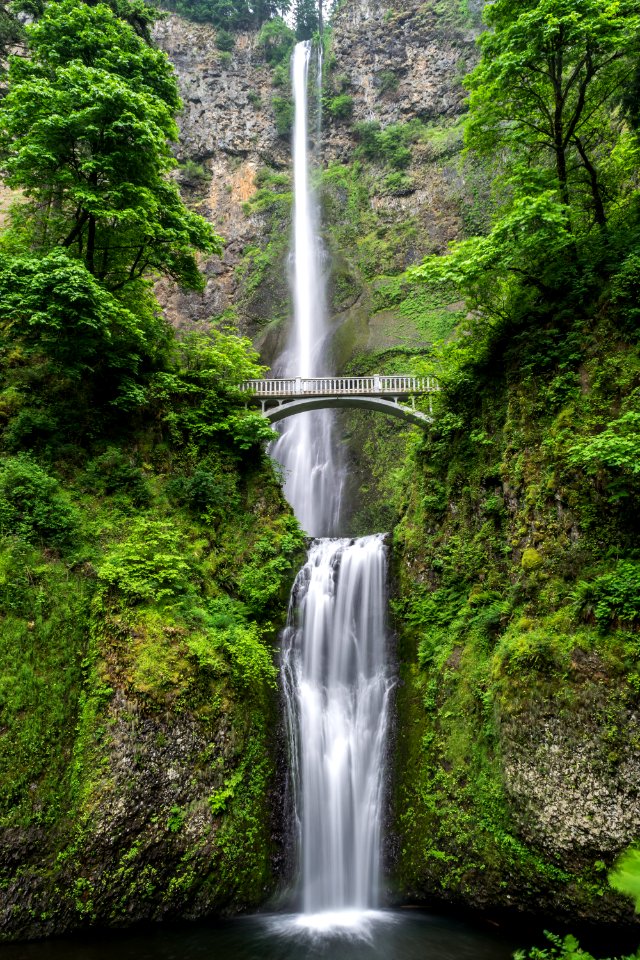 gray concrete bridge and waterfalls during daytime photo