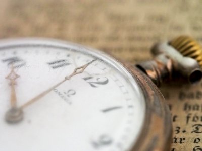 closeup photo of gold-colored pocket watch photo