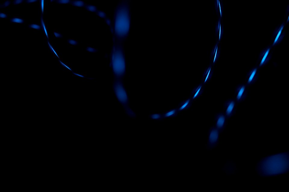 A dim shot of a glossy spiral against a dark background