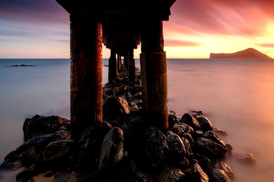 brown dock in body of water