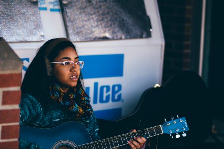 woman playing guitar photo