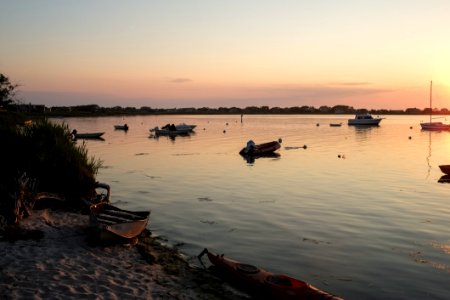 boat on lake during golden hour photo