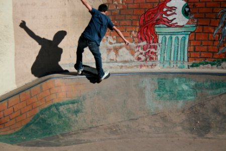 man skateboarding on concrete rail photo