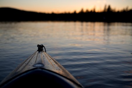 shallow focus photography of white boat on body of water