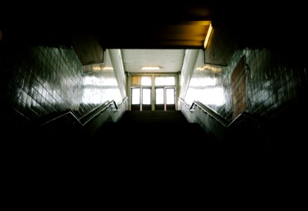 long angle photography of dark staircase photo