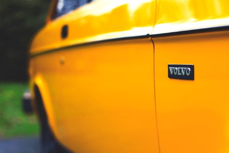 close up photography of yellow Volvo car